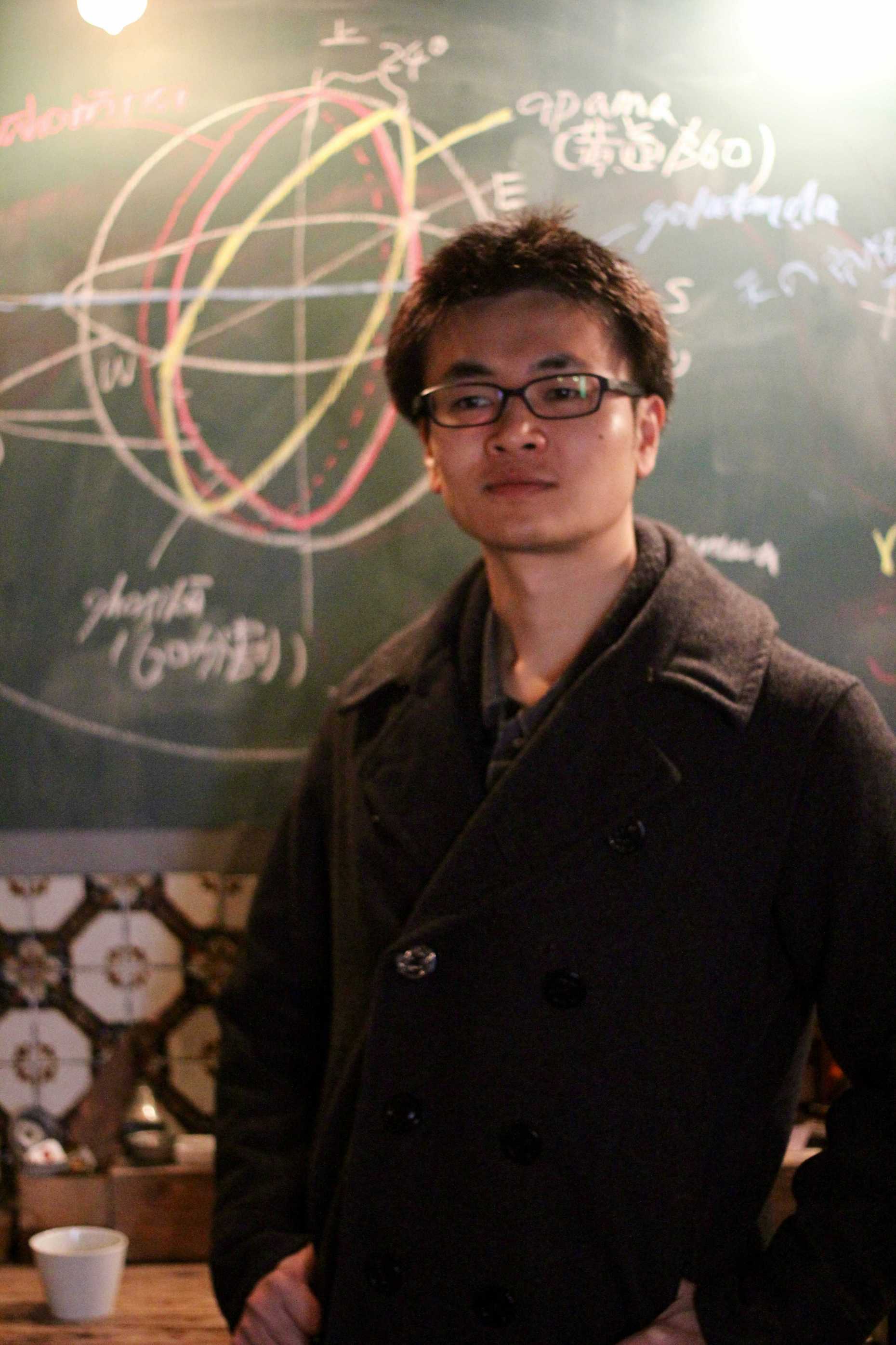 Image of Sho Hirose in front of a black board